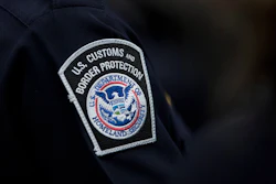 A customs agent wears a patch for the U.S. Customs and Border Protection agency, Oct. 27, 2017, at John F. Kennedy International Airport in New York.