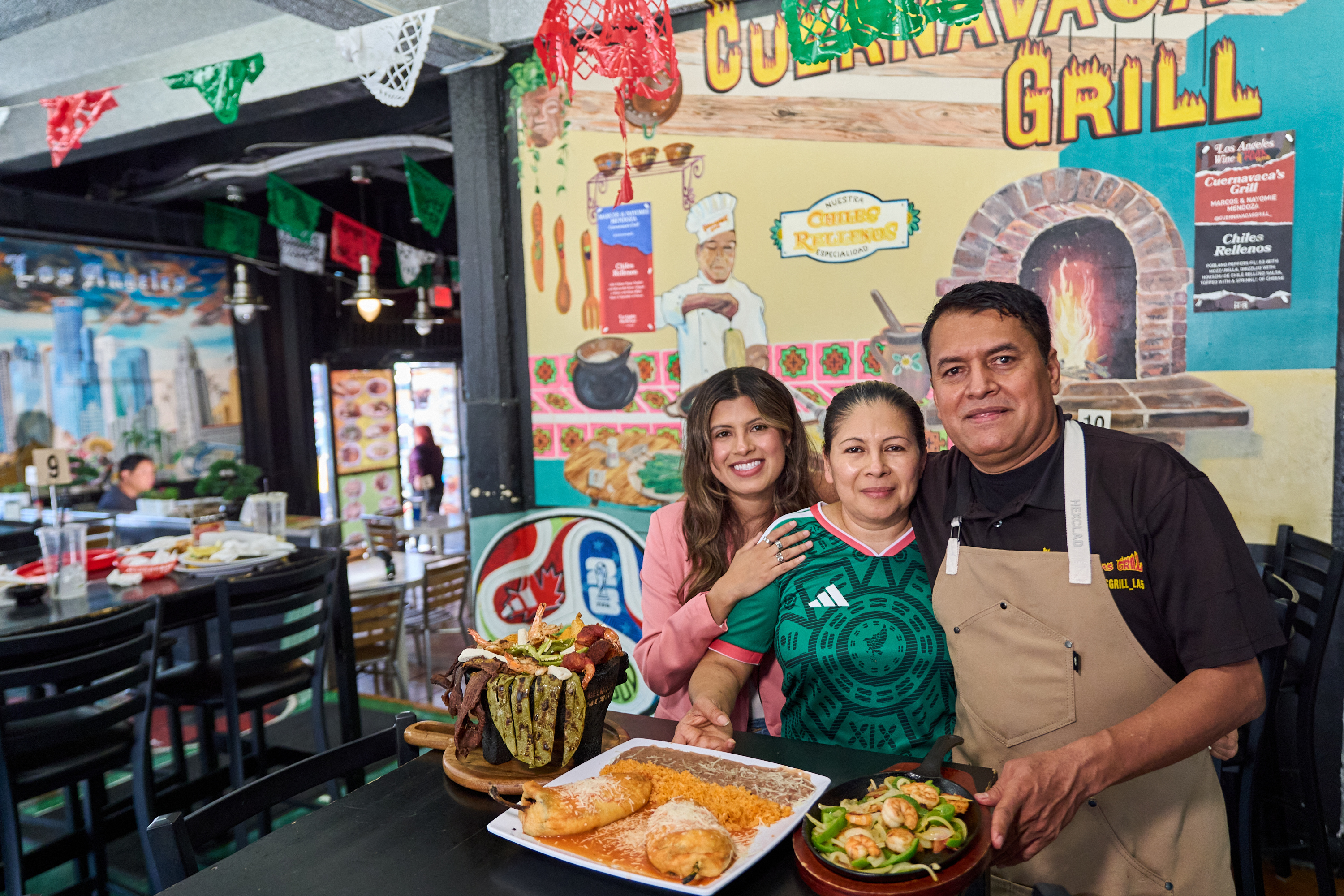 Chef Marco Mendoza, right, his wife Maria Luisa Mendoza, center, and daughter Nayomie Mendoza at Cuernavaca's Grill in Los Angeles, April 28, 2026.