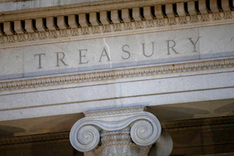 The Treasury Department building is pictured at dusk in Washington, June 6, 2019.