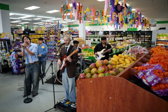 Luna Luna performs in the produce section of Fiesta Fresh Market in New Castle, Del., April 26, 2026.
