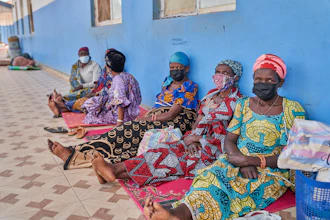 People in protective masks wait in the corridor of a hospital in Bunia, Congo, May 19, 2026.