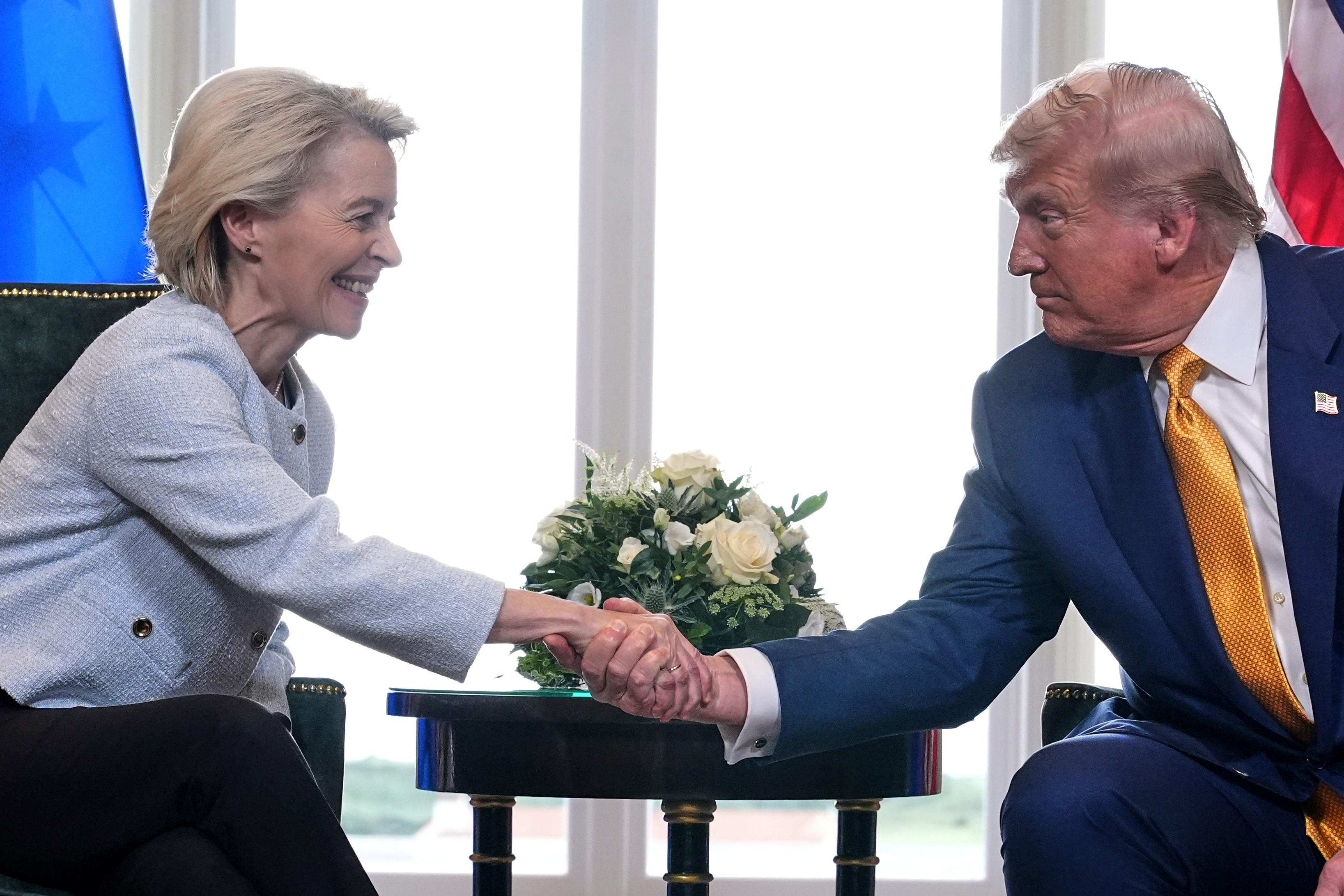President Donald Trump and European Commission President Ursula von der Leyen shake hands after reaching a trade deal, Turnberry, Scotland, July 27, 2025.