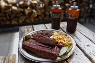 A plate of ribs and sausage at the Little Miss BBQ in Phoenix, May 19, 2026.