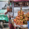 An electric rickshaw driver splashes water on his face to cool off under intense heat in Lucknow, India, May 20, 2026.