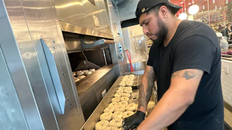 A worker at Utopia Bagel in Queens, New York, May 13, 2026.