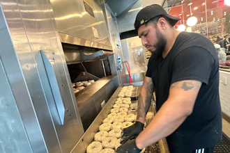 A worker at Utopia Bagel in Queens, New York, May 13, 2026.