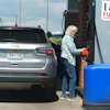 A motorist swipes a credit card at a gas station, May 24, 2026, Sheridan, Colo.