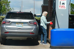 A motorist swipes a credit card at a gas station, May 24, 2026, Sheridan, Colo.