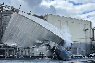 This photo provided by the City of Longview, Wash., shows structural damage to the Nippon Dynawave Packaging Co., after a tank containing hazardous liquid imploded, on Tuesday, May 26, 2026 in Longview, Wash.