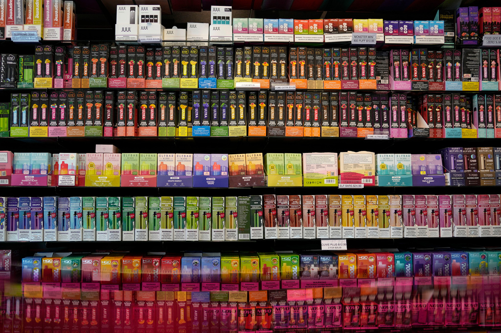 Disposable flavored electronic cigarette devices are displayed for sale at a store in Pinecrest, Fla., June 26, 2023.