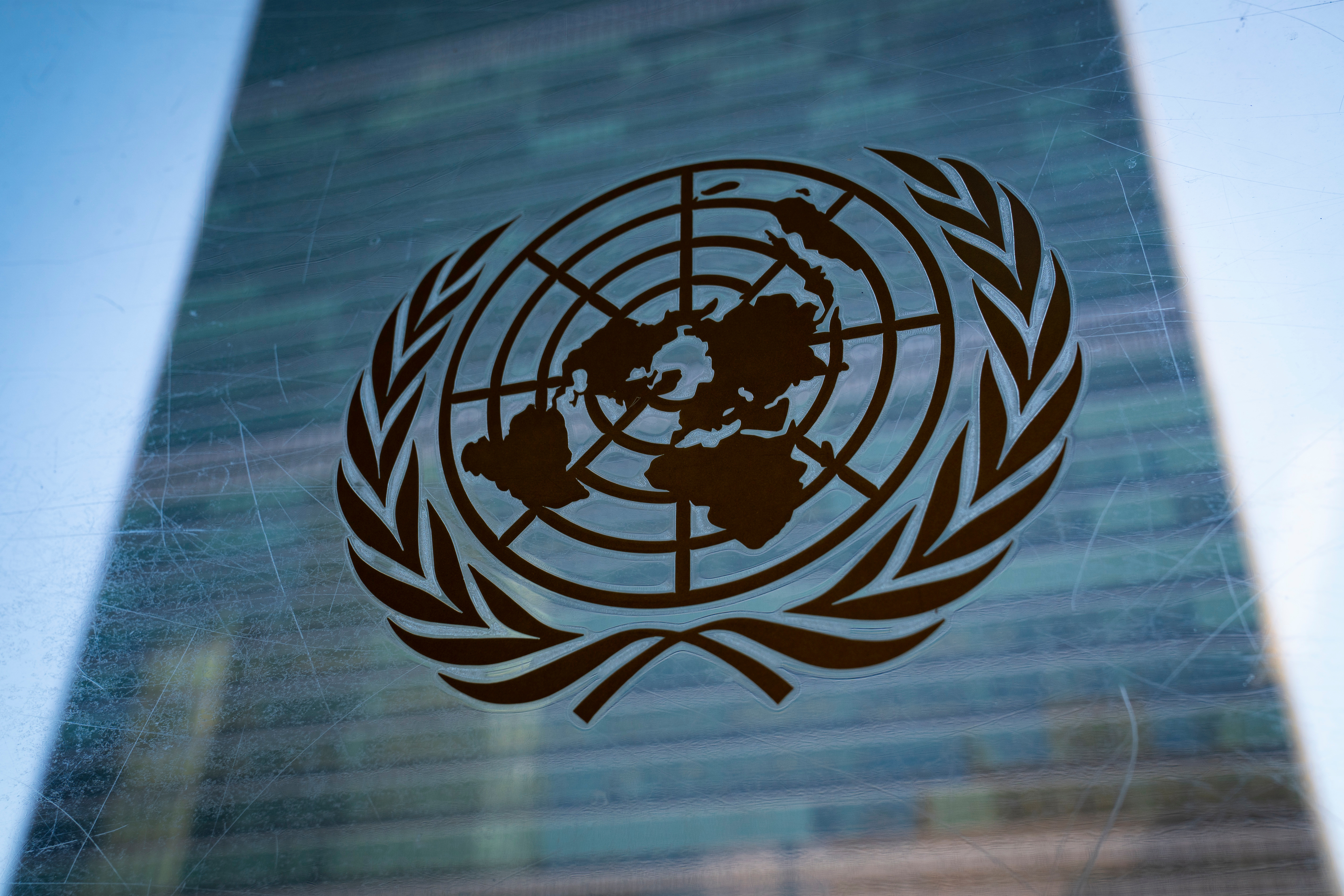 The symbol of the United Nations is displayed outside the Secretariat Building, Feb. 28, 2022.