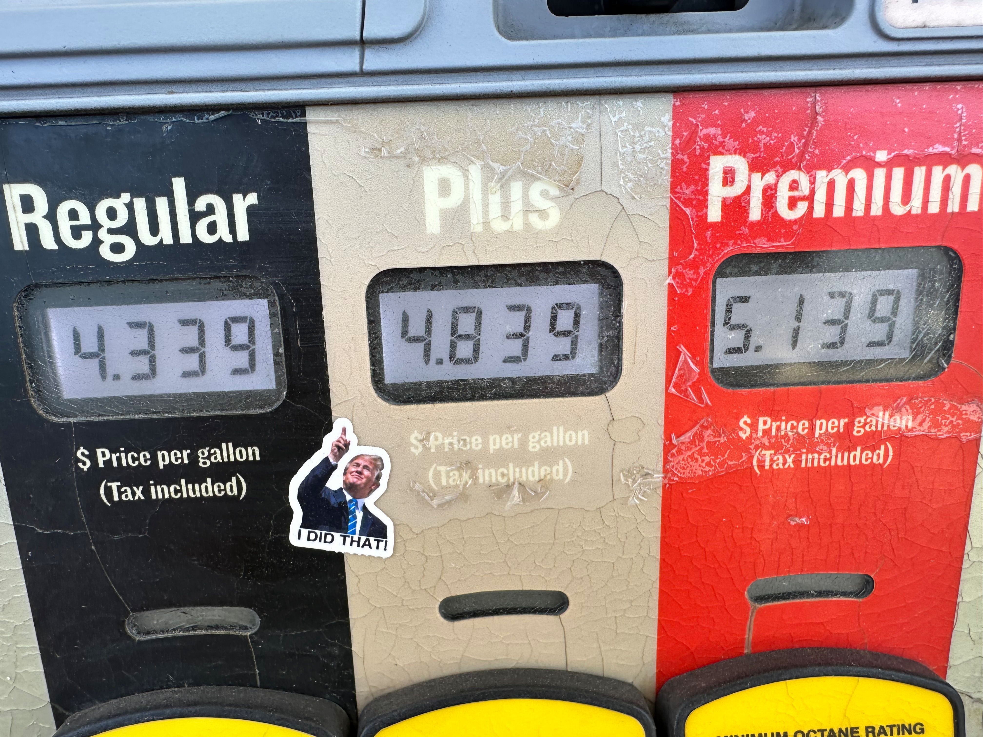 A sticker with the image of President Trump points to per-gallon prices for gasoline at a Conoco station in Denver, May 30, 2026.