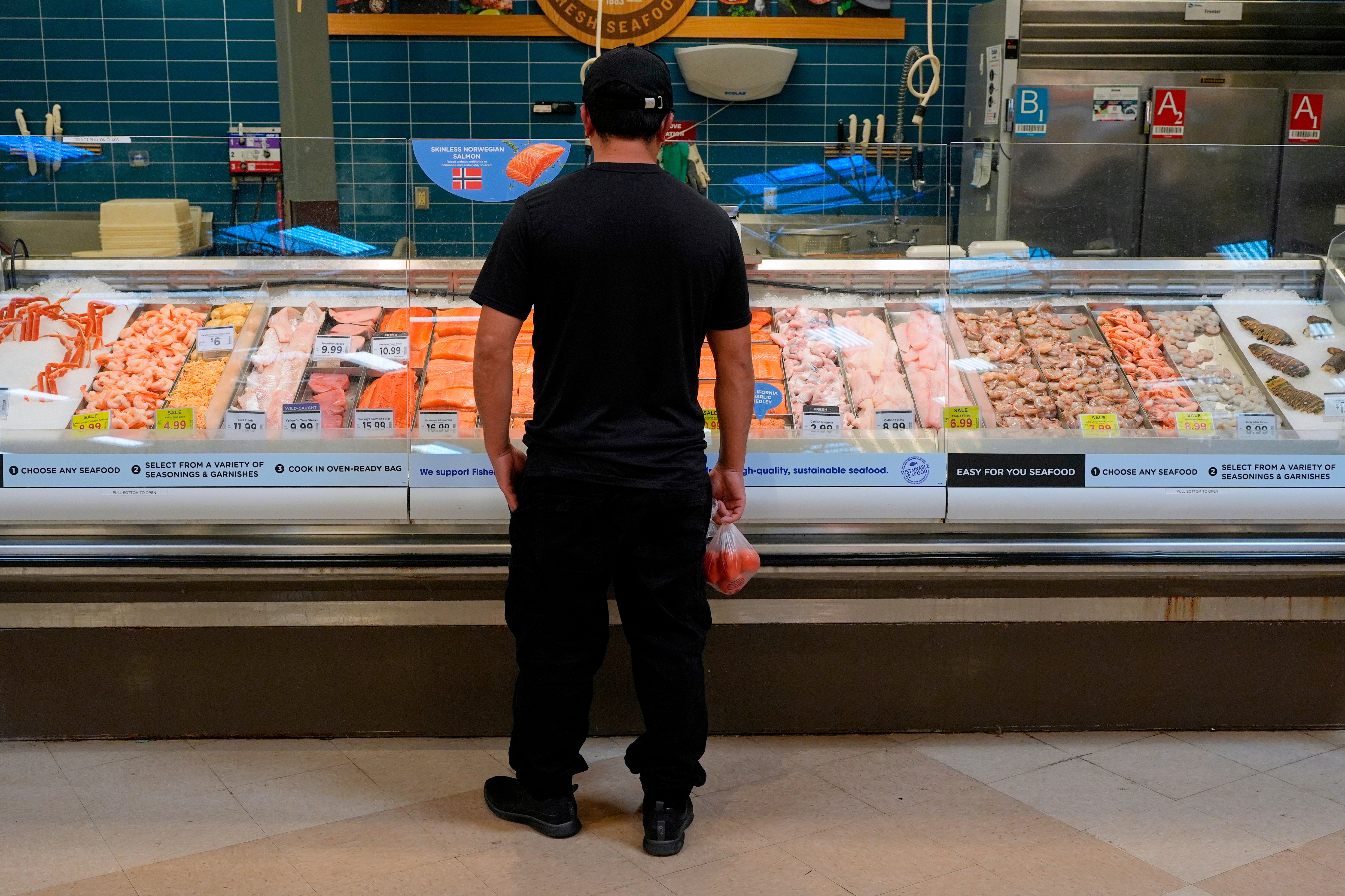 A person looks at fresh fish at a grocery store in Nashville, May 11, 2026.
