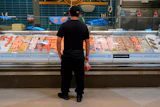 A person looks at fresh fish at a grocery store in Nashville, May 11, 2026.