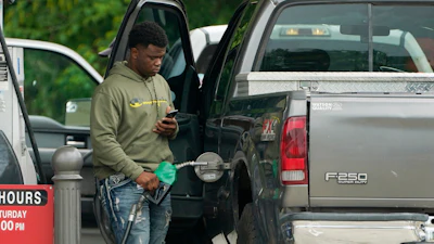 A customer prepares to pump fuel at a Sam's Club, Madison, Miss., May 24, 2022.