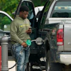 A customer prepares to pump fuel at a Sam's Club, Madison, Miss., May 24, 2022.