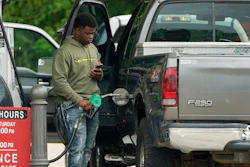 A customer prepares to pump fuel at a Sam's Club, Madison, Miss., May 24, 2022.