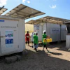 Workers carry fresh herbs from Soko Fresh solar-powered cold rooms at Citadel Agri Merchants, Kitengela, Kenya, May 22, 2026.