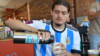Sebastian Cufre, from Albuquerque, N.M., pours hot water over his cup of yerba mate at Cafe Corazon, Kansas City, Mo., June 15, 2026.