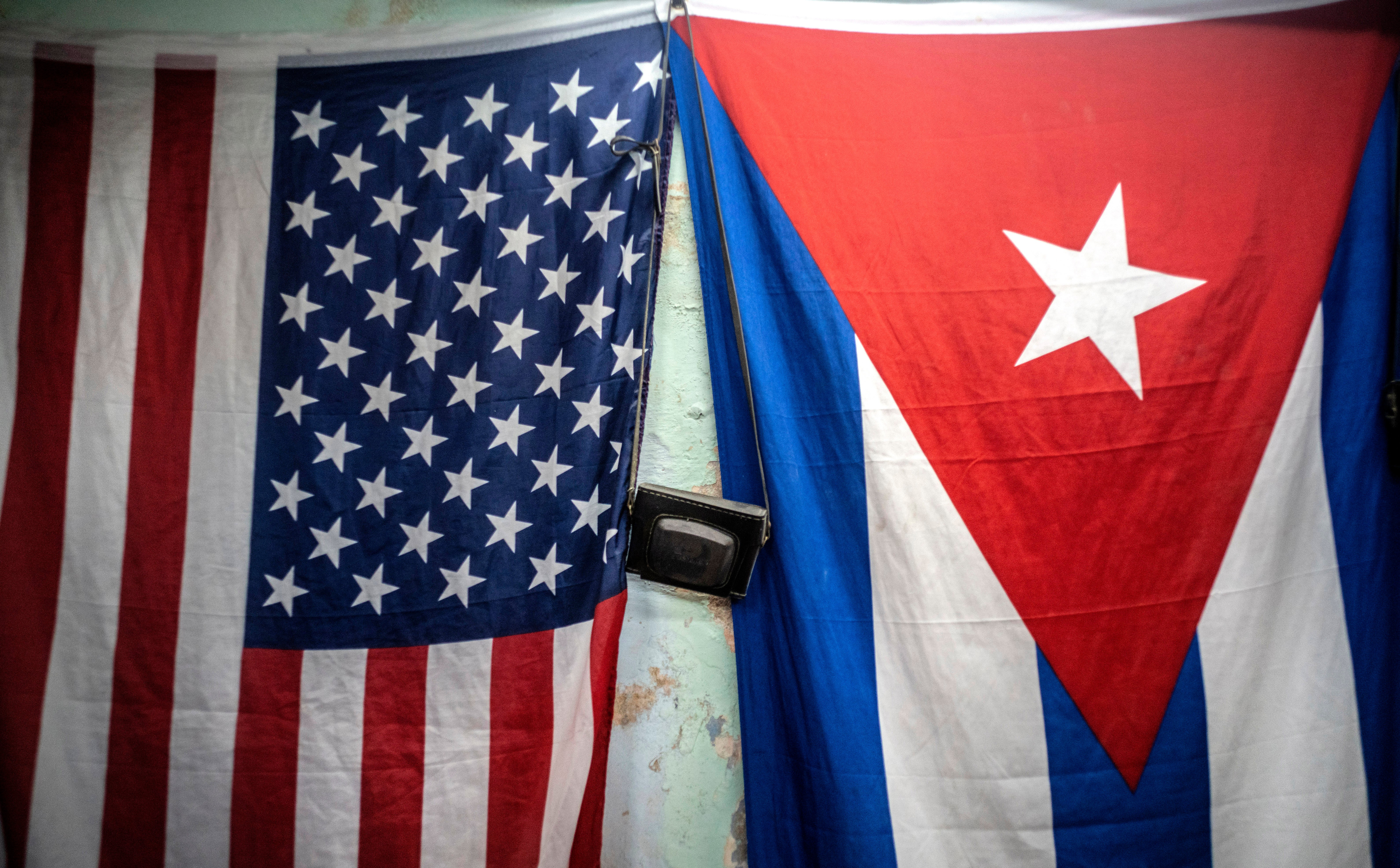 A U.S. and Cuban flag on a wall in Havana, Jan. 11, 2021.