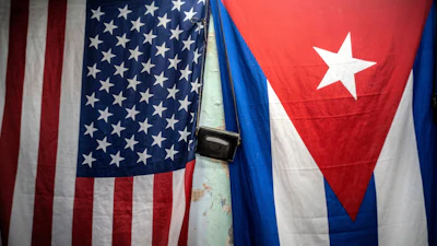 A U.S. and Cuban flag on a wall in Havana, Jan. 11, 2021.