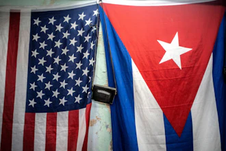 A U.S. and Cuban flag on a wall in Havana, Jan. 11, 2021.