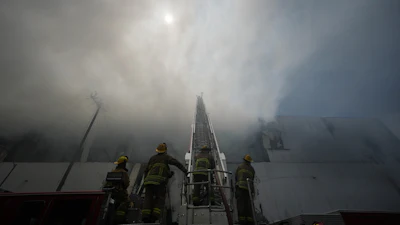 Firefighters fight a warehouse fire in the Boyle Heights neighborhood of Los Angeles, Sunday, June 21, 2026.
