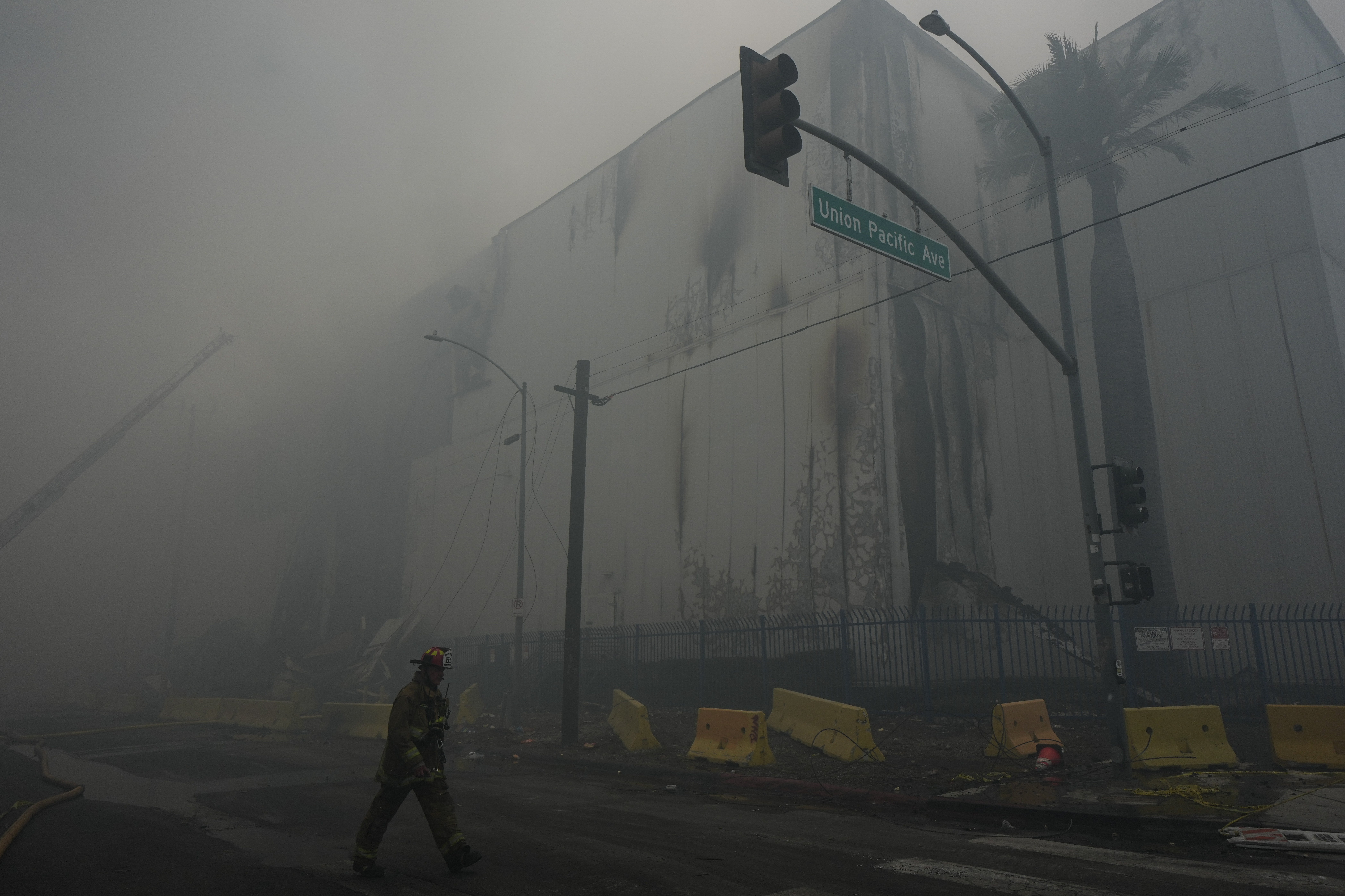 Smoke from a warehouse fire fills the air in the Boyle Heights neighborhood of Los Angeles, June 21, 2026.