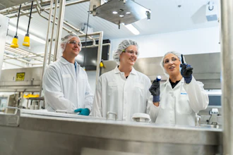 Nelson Jameson Employee And Customers Looking At Plant Equipment