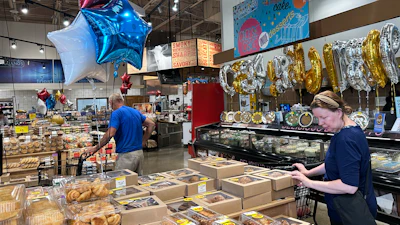 Customers shop at a grocery store in Chicago, June 25, 2026.