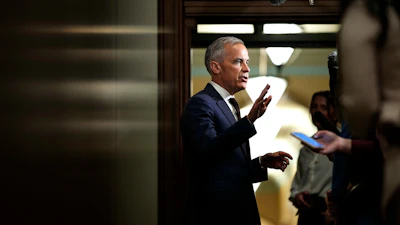 Canadian Prime Minister Mark Carney takes questions from journalists as he arrives on Parliament Hill in Ottawa, June 2, 2026.