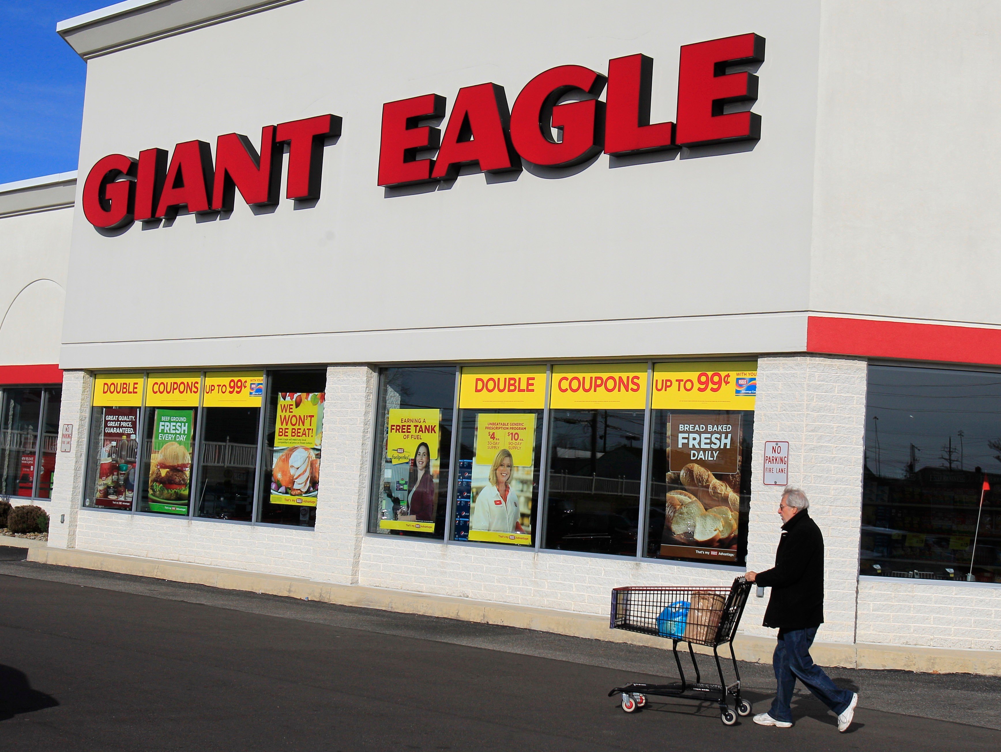 A man walks out of the Giant Eagle grocery store, Nov. 17, 2011, Mayfield Heights, Ohio.