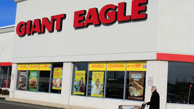 A man walks out of the Giant Eagle grocery store, Nov. 17, 2011, Mayfield Heights, Ohio.