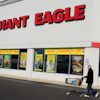 A man walks out of the Giant Eagle grocery store, Nov. 17, 2011, Mayfield Heights, Ohio.