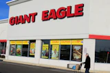 A man walks out of the Giant Eagle grocery store, Nov. 17, 2011, Mayfield Heights, Ohio.