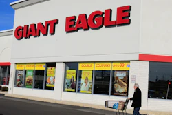 A man walks out of the Giant Eagle grocery store, Nov. 17, 2011, Mayfield Heights, Ohio.