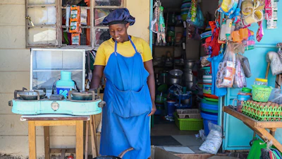 Grace Kathambi uses a bioethanol fuel stove to fry and sell French fries at her shop in Kibera, an informal settlement on the outskirts of Nairobi, Kenya, Feb. 4, 2026.