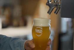 Boston Beer Co. founder and CEO Jim Koch pours a beer at the company's headquarters in Boston, July 7, 2026.