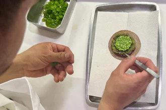 A tostada with bluefin tuna is prepared at Californios in San Francisco, July 16, 2026.