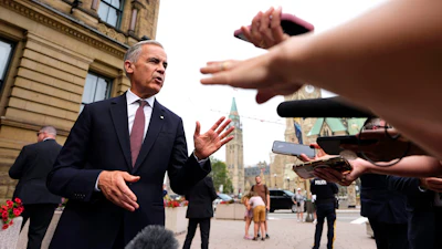 Canada Prime Minister Mark Carney takes questions outside the Office of the Prime Minister and Privy Council in Ottawa, July 21, 2026.