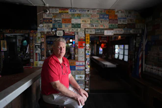 Bobby Kuchinsky, general manager of Half Shell Raw Bar, poses inside his restaurant in Key West, Fla., July 25, 2026.