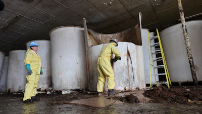 Sludge pours out of a vat of fermenting fish sauce in an abandoned factory, St. Mary's, Newfoundland and Labrador, July 28, 2026.