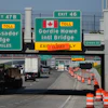 Exits from Interstate 75 are displayed for the Gordie Howe International Bridge and Ambassador Bridge connecting Windsor, Ontario, with Detroit, Tuesday, July 14, 2026,