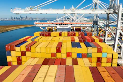 Cargo containers line a ship at the Port of Oakland on Wednesday, Aug. 6, 2025, in Oakland, Calif.