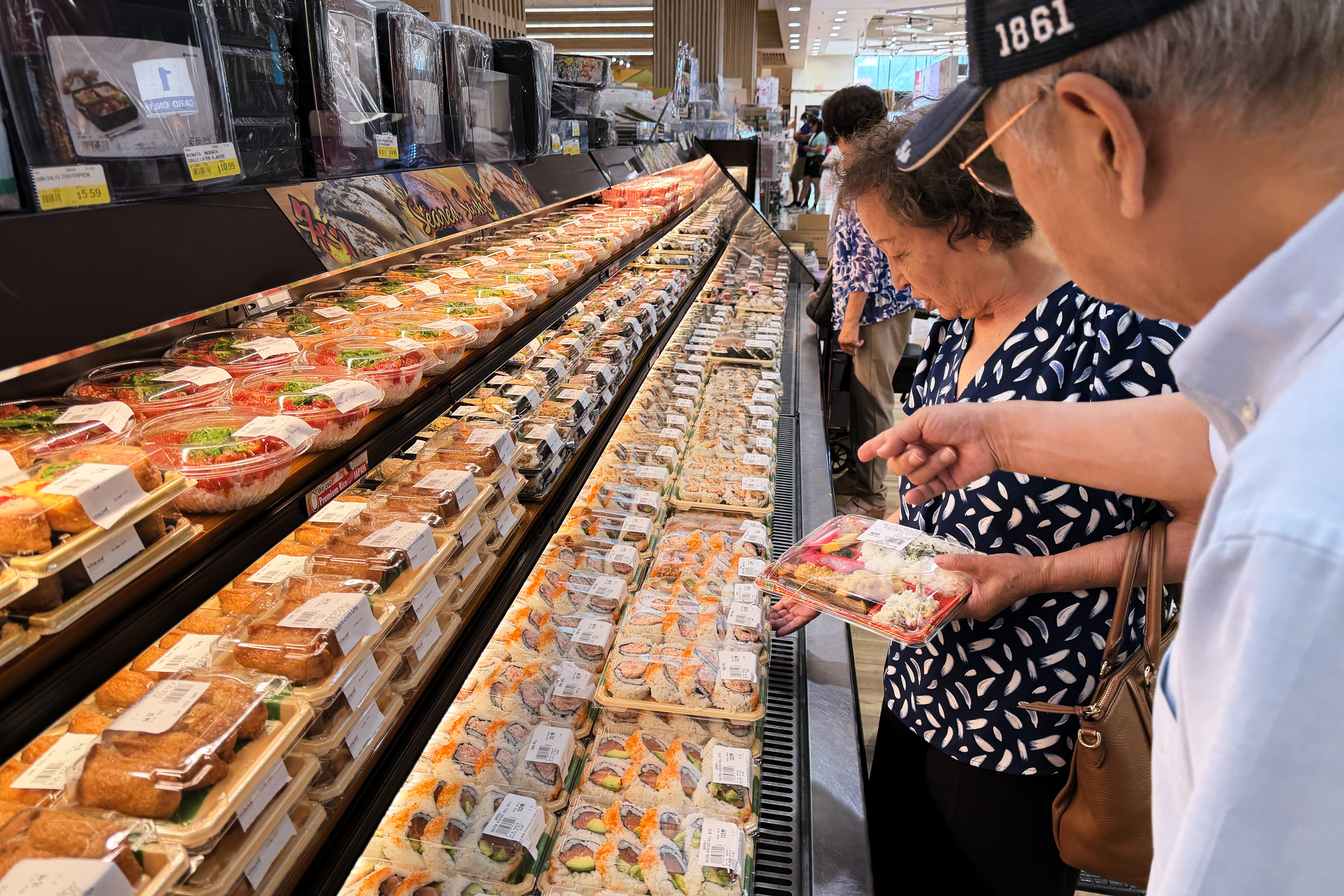 Customers at a grocery store in Arlington Heights, Ill., July 6, 2026.