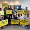 A coalition of farmers, consumer and environmental groups hold placards after a press conference at the Greenpeace office in Kuala Lumpur, Aug. 11, 2026.
