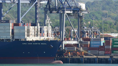 Cranes load a cargo ship at the Panama Canal's Port of Balboa, Panama City, Jan. 30, 2026.