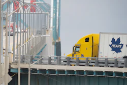 Transport trucks cross the Ambassador Bridge into the U.S. in Windsor, Ontario, Aug. 22, 2026.