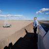 Tom Brundy looks over his field that is being prepared for planting near Calexico, Calif., Feb. 28, 2023.