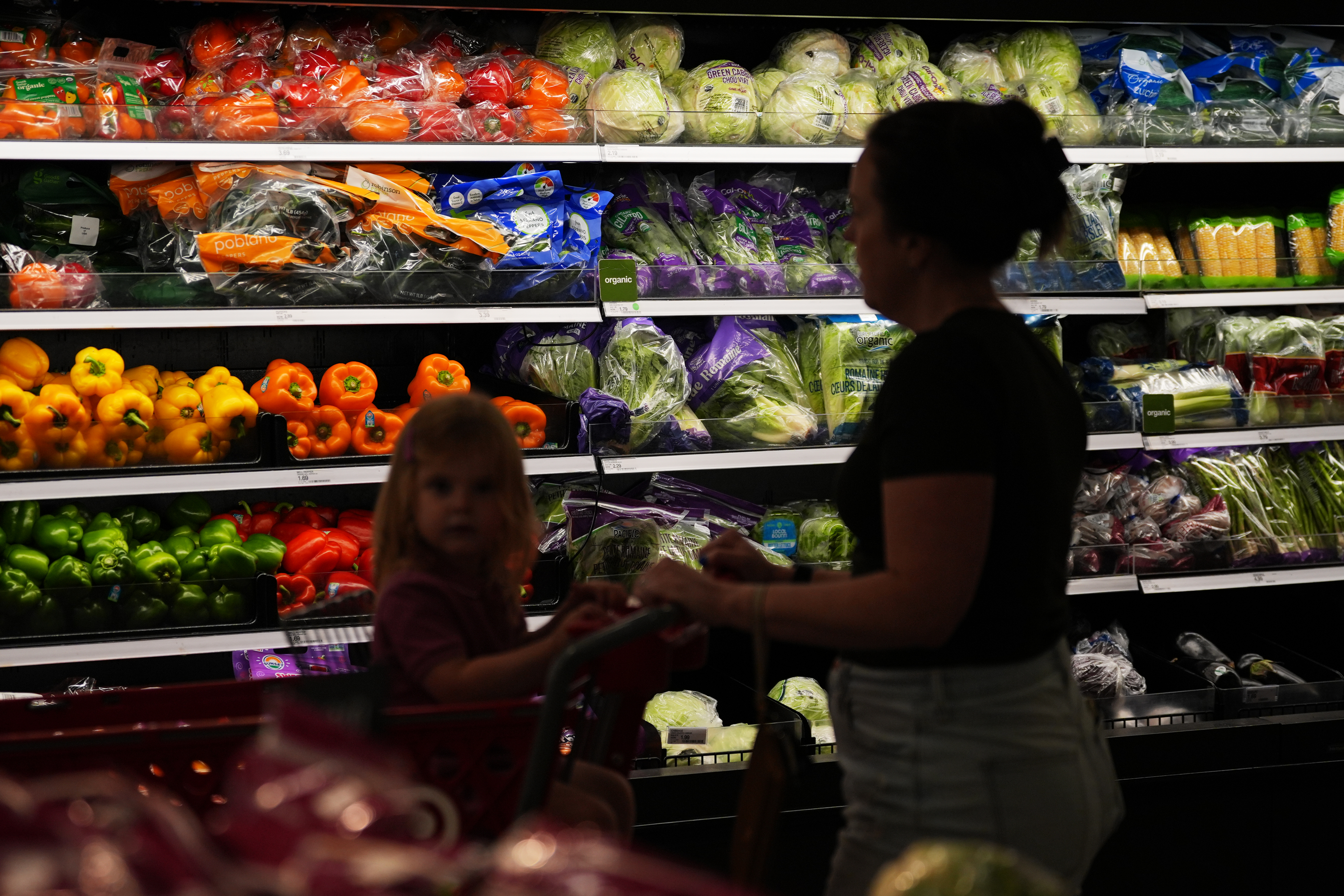 Shoppers browse the produce section at a Target store, Aug. 13, 2026, Woodbury, Minn.